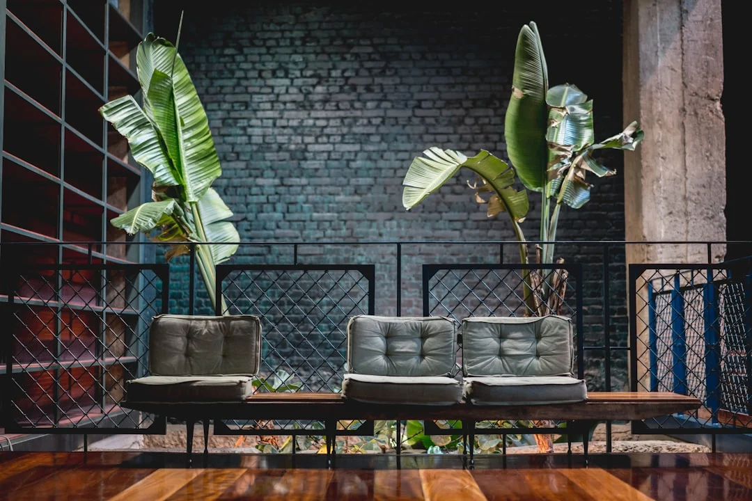 a couple of couches sitting on top of a wooden floor. related to Industrial Home Design Without the Cold Warehouse Feel: A Practical Guide