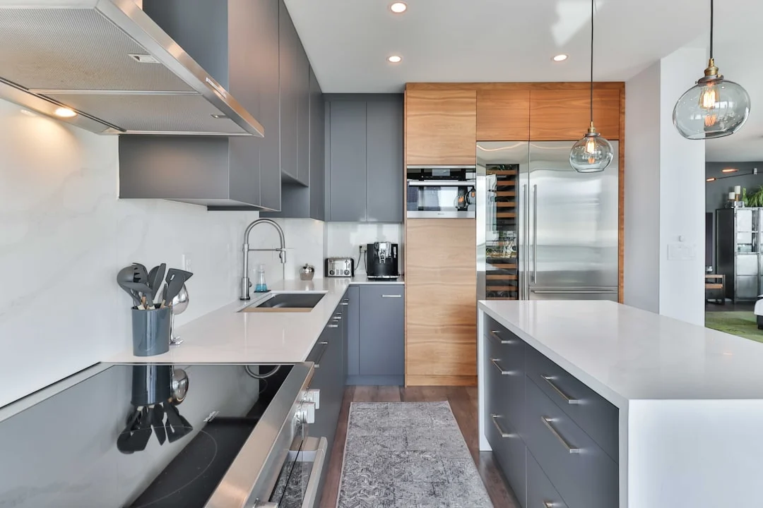 a kitchen with a bar and island. related to Modern Kitchen Decor That Actually Works: Balancing Aesthetics With Everyday Life