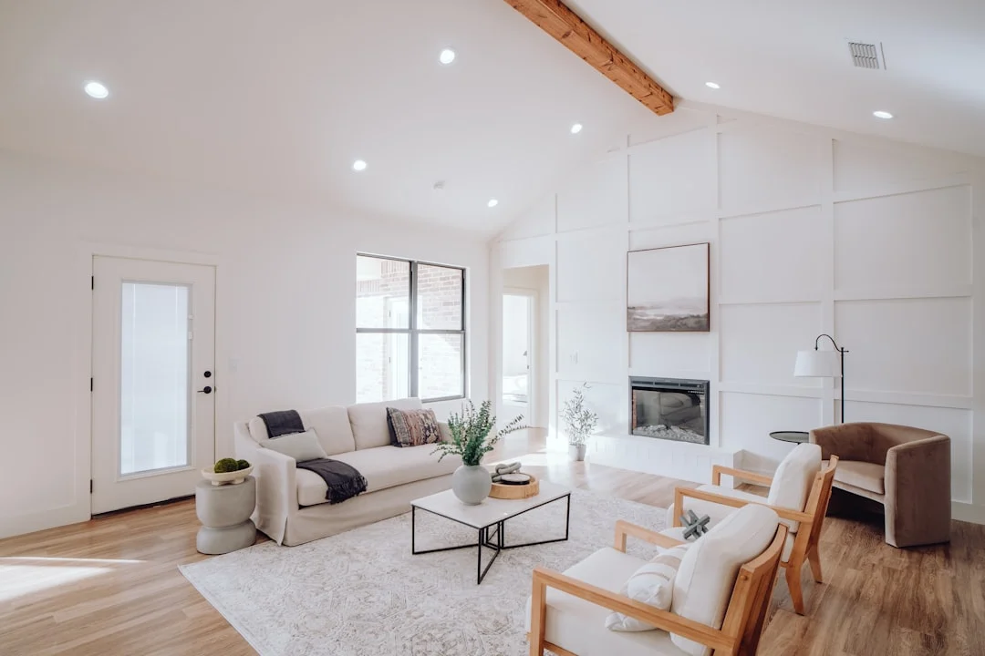 a living room filled with furniture and a fire place. related to How to Build a Modern Interior That Doesn't Feel Cold or Dated