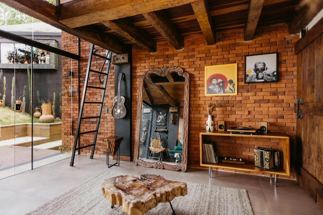 A living room with brick walls and a ladder. related to Industrial Home Design Without the Cold Warehouse Feel: A Practical Guide