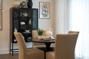Dining table with chairs and a cabinet. related to How to Choose a Dining Room Centerpiece That Doesn't Block Your View