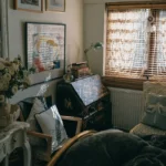 a bedroom with a bed and a desk with a laptop on it. related to Aesthetic Room Decor: Curate Instead of Clutter