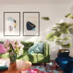 green and purple flower in blue ceramic vase on brown wooden table. related to How to Decorate Your Living Room Walls Without Making These 5 Common Mistakes