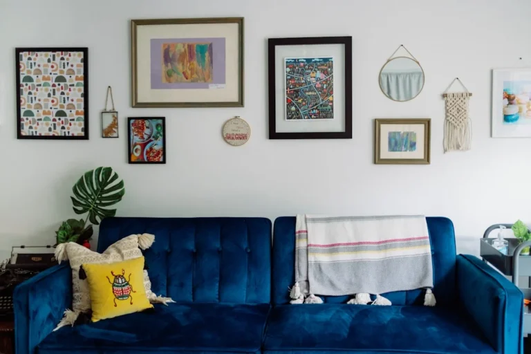 blue sofa with white and blue towel. related to Boho Chic Decor: How to Layer Textures and Patterns Without Turning Your Space Into a Cluttered Mess
