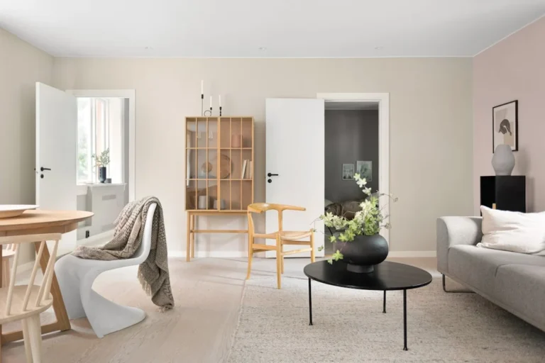 A living room filled with furniture and a table. related to Warm Scandinavian Decor: How to Make Minimalist Nordic Interiors Feel Lived-In (Not Sterile)