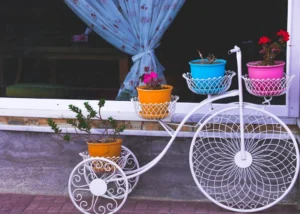 white adult trike plant stand. related to DIY Home Decor Projects: Which Ones Actually Pay Off?