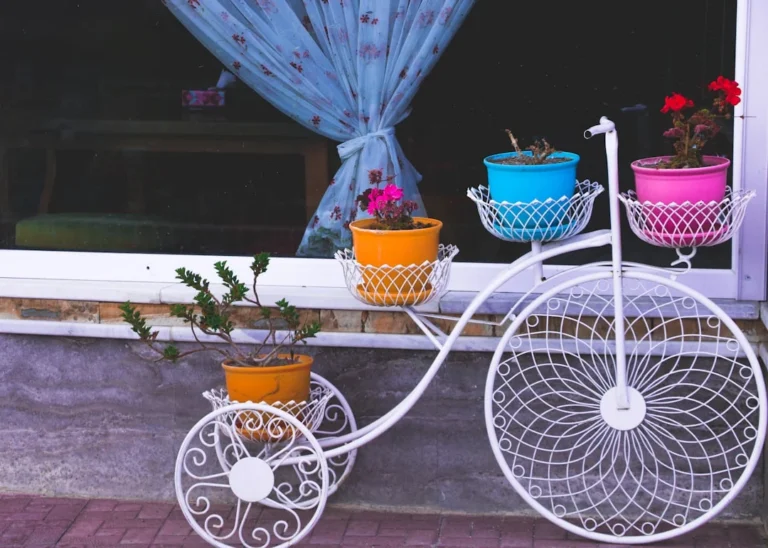 white adult trike plant stand. related to DIY Home Decor Projects: Which Ones Actually Pay Off?