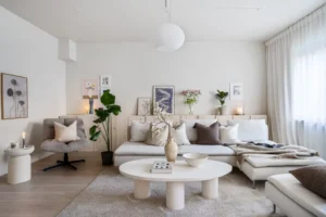 A living room filled with furniture and a large window. related to Neutral Room Decor Is a Layered System of Warm, Cool & Earth Tones