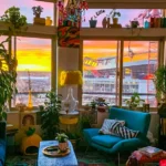 A plant-filled maximalist apartment home decor in front of Mile High Stadium in Denver during a colorful sunrise. related to Best Indoor Plants for Living Room Decor: Match Your Species to Your Space