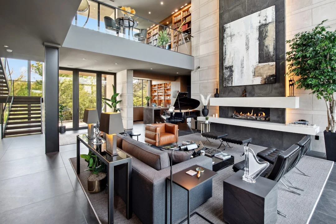 Modern living room with fireplace and grand piano.. related to How to Create an Authentic Mid-Century Modern Home Without Buying Expensive Originals
