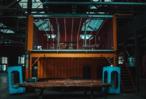 orange and black metal building. related to Industrial Home Design Without the Cold Warehouse Feel: A Practical Guide