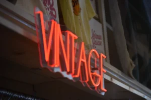 red and white love me neon light signage. related to Authentic Vintage vs. Reproduction: How to Spot Real Vintage Accessories and Build a Cohesive Collection