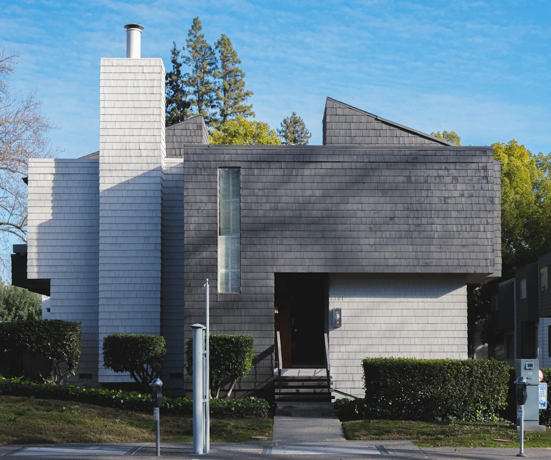 white and grey house.. related to How to Create an Authentic Mid-Century Modern Home Without Buying Expensive Originals