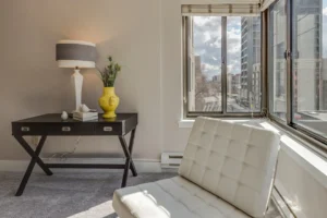 white table lamp. related to How to Decorate a Small Apartment Living Room (Without Overcrowding It)