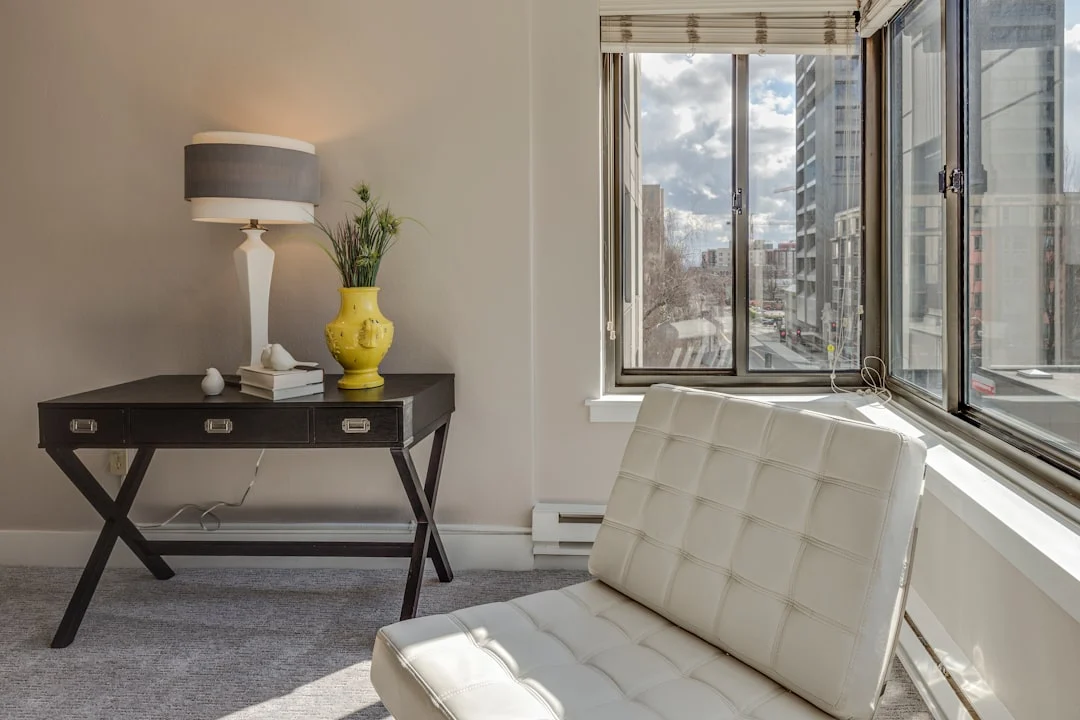 white table lamp. related to How to Decorate a Small Apartment Living Room (Without Overcrowding It)